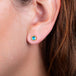 Apatite stud earrings on a model