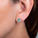 Hexagon aquamarine earrings on model