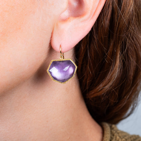 Amethyst earrings on a model