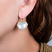 Rock crystal earrings on a model