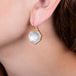 Rock crystal earrings on a model side view