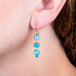 Ethiopian Opal pebble earrings on a model