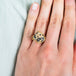 Carved leopard cub ring on a model.