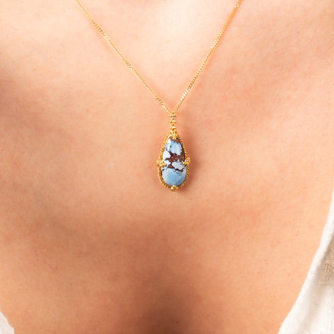 Turquoise teardrop necklace on model