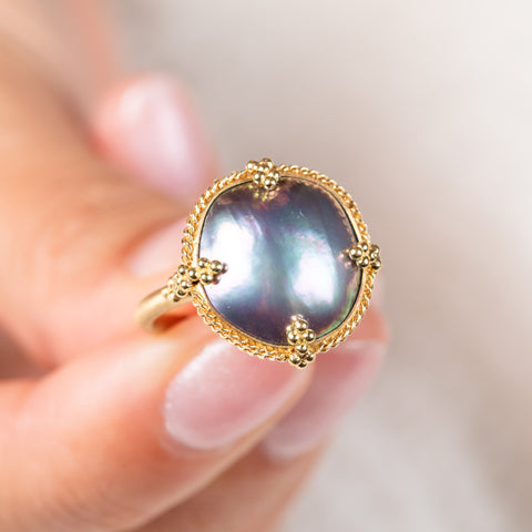 Mabe pearl and gold ring close up