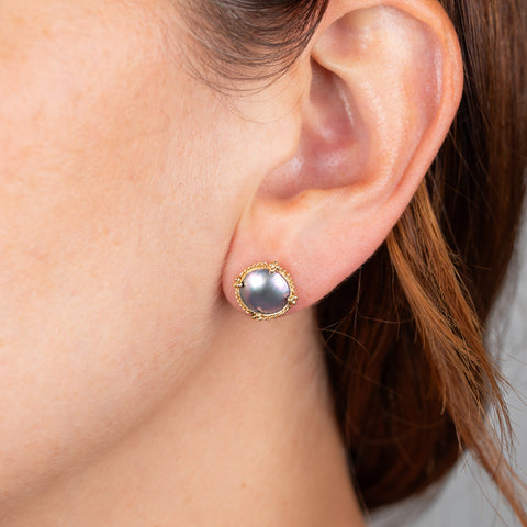 Mabe pearl stud earrings on model 