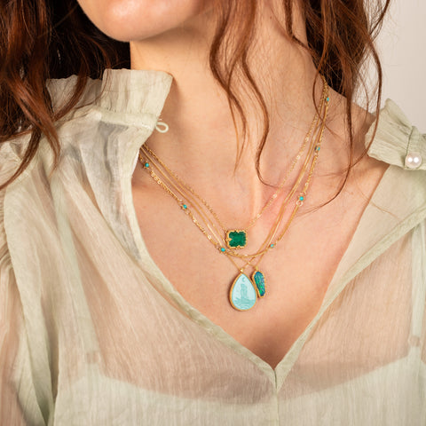 Emerald paired with mermaid and opal necklaces