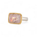 Handcrafed ring featuring a mexican opal gemstone in an 18k gold setting with a sterling silver band