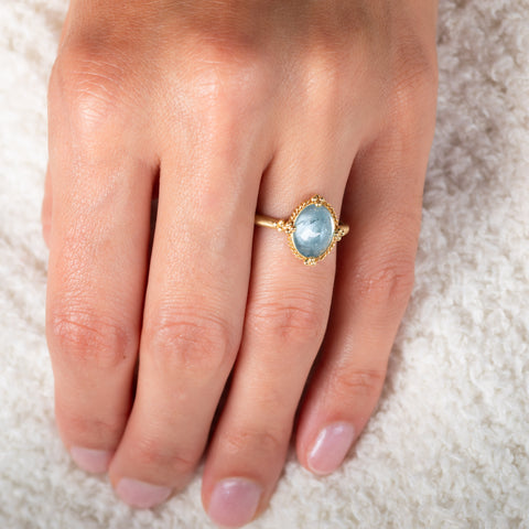 Aquamarine and gold ring on model