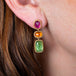 Mixed gemstone earrings on model