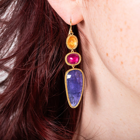 Mixed gemstone earrings on model