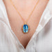 Moonstone galaxy necklace on model