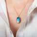 Moonstone galaxy necklace on model side view