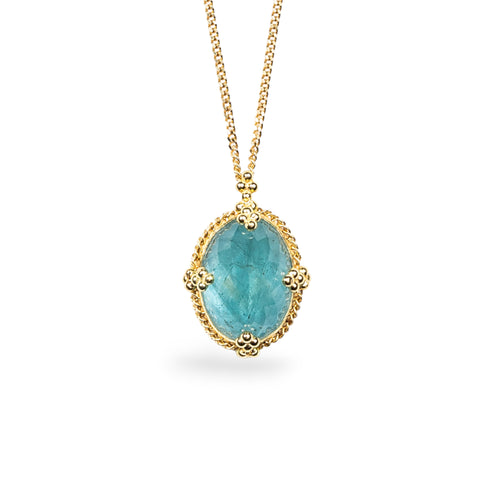 An oval Aquamarine pendant in 18k yellow gold bezel, adorned with braided gold accents and granulated prongs. Pendant measures 17 x 13mm, with a versatile 16" or 18" chain and lobster clasp closure. Handmade in New York