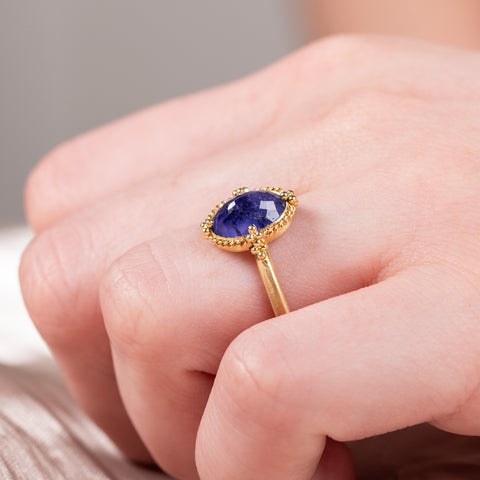 Oval tanzanite ring on model side view