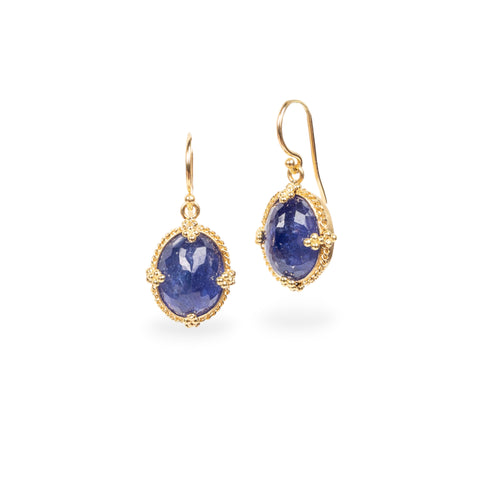 Oval tanzanite earrings on white background
