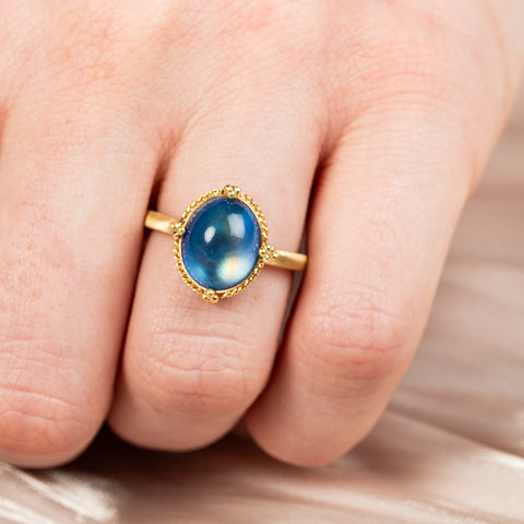 Oval moonstone ring on model close up