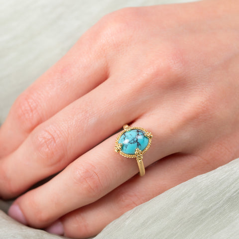 Oval turquoise ring on a model