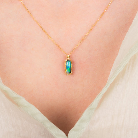 Boulder opal necklace on model
