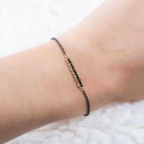 Petite contrast textile bracelet on a model