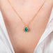 Emerald teardrop necklace on model