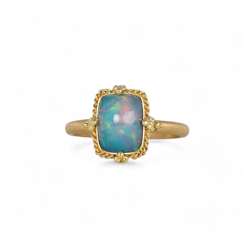 Petite ethiopian opal ring on white