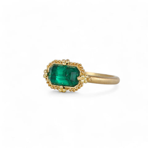Petite emerald ring on white side view