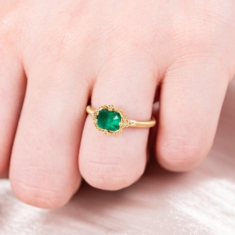 Petite emerald ring on model