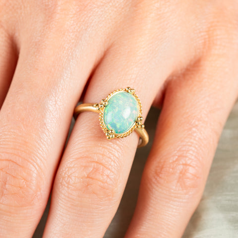 Petite Oval Opal Ring on model close up
