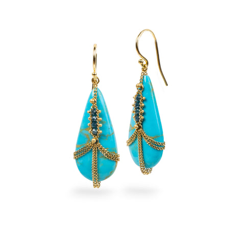 Petite Turquoise Draped Earrings adorned with blue diamonds.