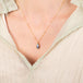 Boulder opal necklace on a model side view