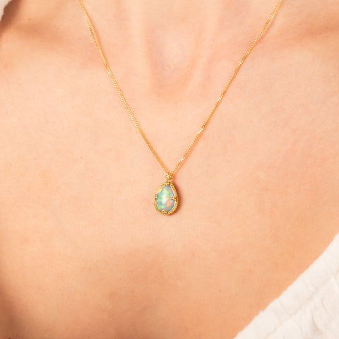 Ethiopian opal necklace on a model side view