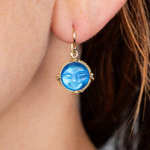 Carved moonstone earring on model
