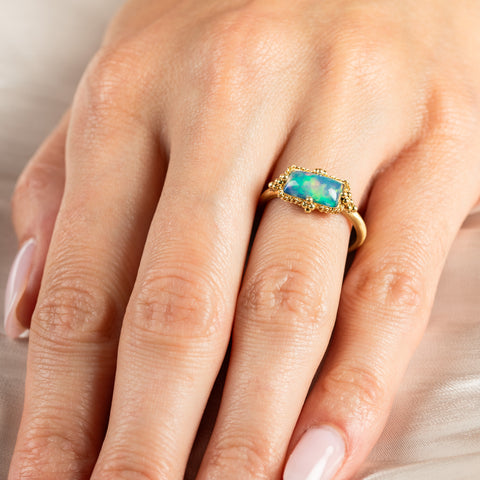 Rectangular ethiopian opal ring on model 