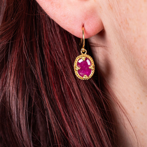 Petite ruby earrings on model