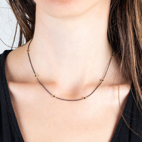 Petite stone black diamond necklace on model