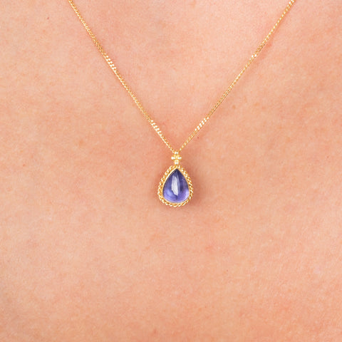 Petite tanzanite necklace on model