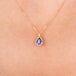 Petite tanzanite necklace on model