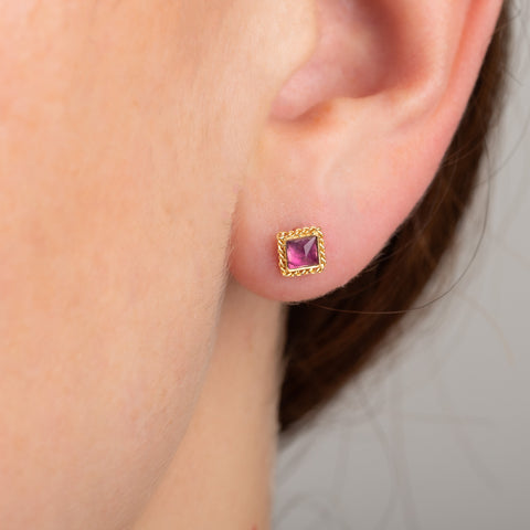 Pink square tourmaline stud earrings on model