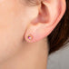Pink square tourmaline stud earrings on model