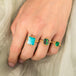 Boudler opal ring paired with Emerald and Turquoise ring