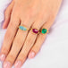Boudler opal ring paired with ruby and emerald rings