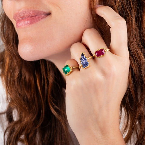 Tanzanite leaf ring paired with Emerald and Ruby rings on model