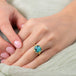 Round turquoise ring on model