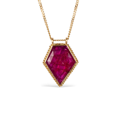 Ruby and gold necklace on white