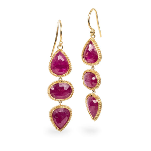 Ruby trio earrings on white background