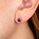 Ruby and gold stud earrings on model