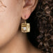 Rutilated quartz and 18k gold earrings on model