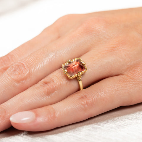 Spessartite and gold ring