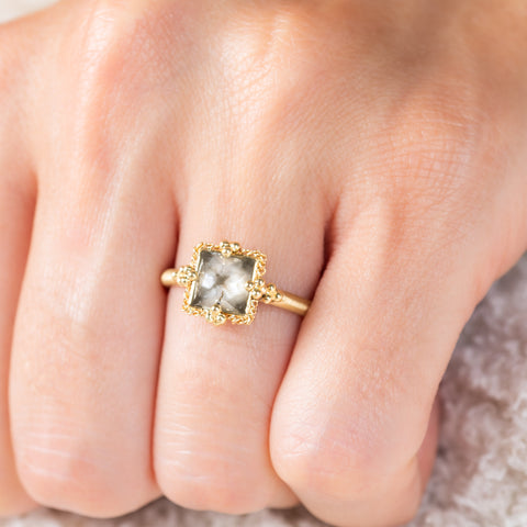 Diamond and gold ring on model